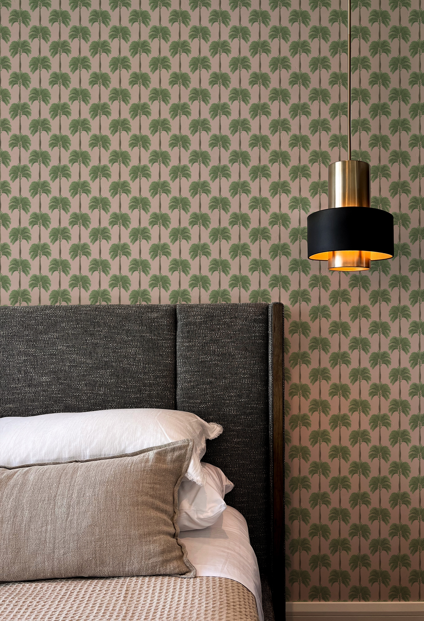 Luxury bedroom with modern lamp and pink palm tree background featuring the Little Palma in Flamingo wallpaper by Deus Ex Gardenia.