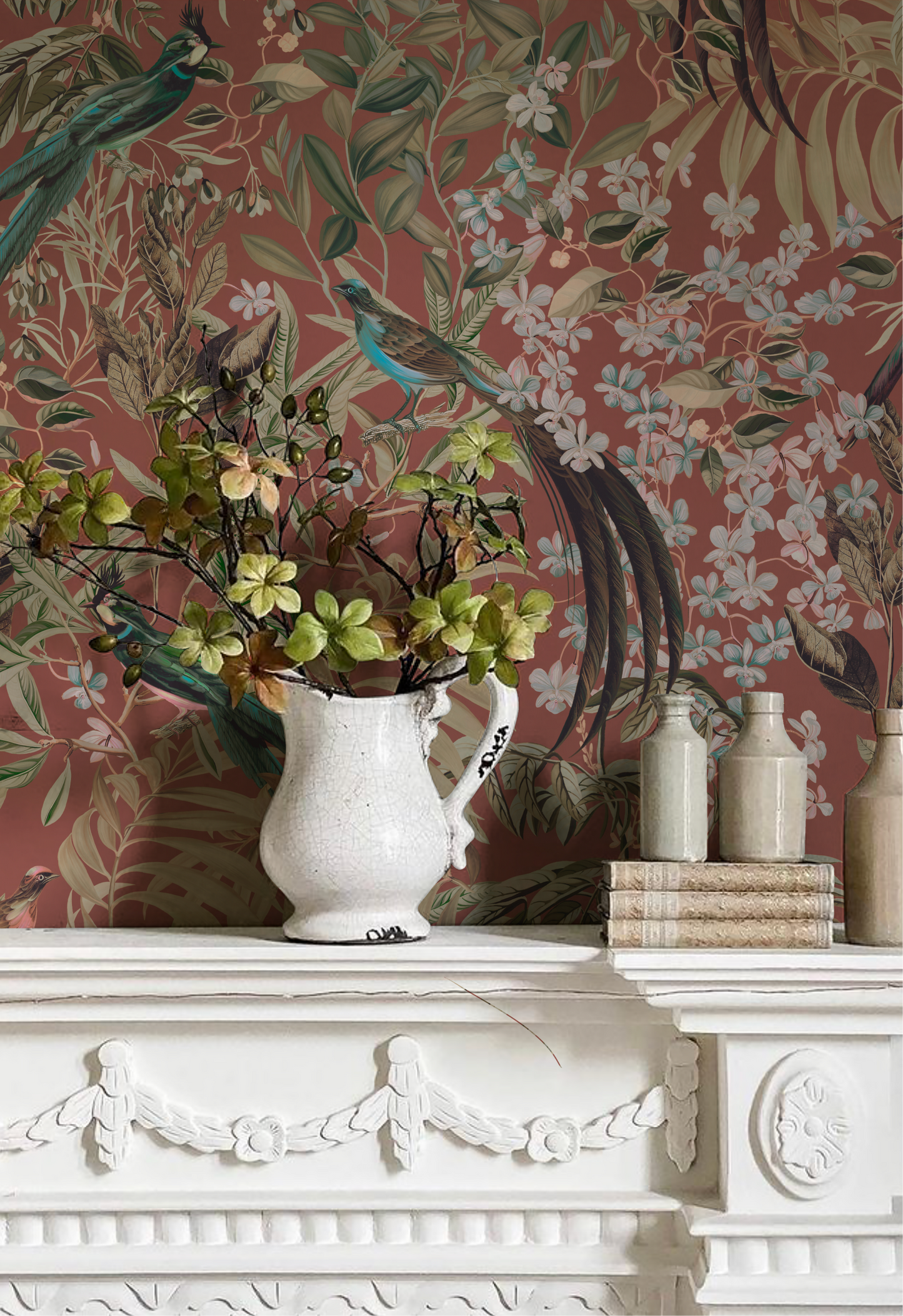 Glamorous room with white fireplace and botanical birds background of Deus ex Gardenia's Resplendent Woods Wallpaper in Terracotta. Photo by The Introverts Home.