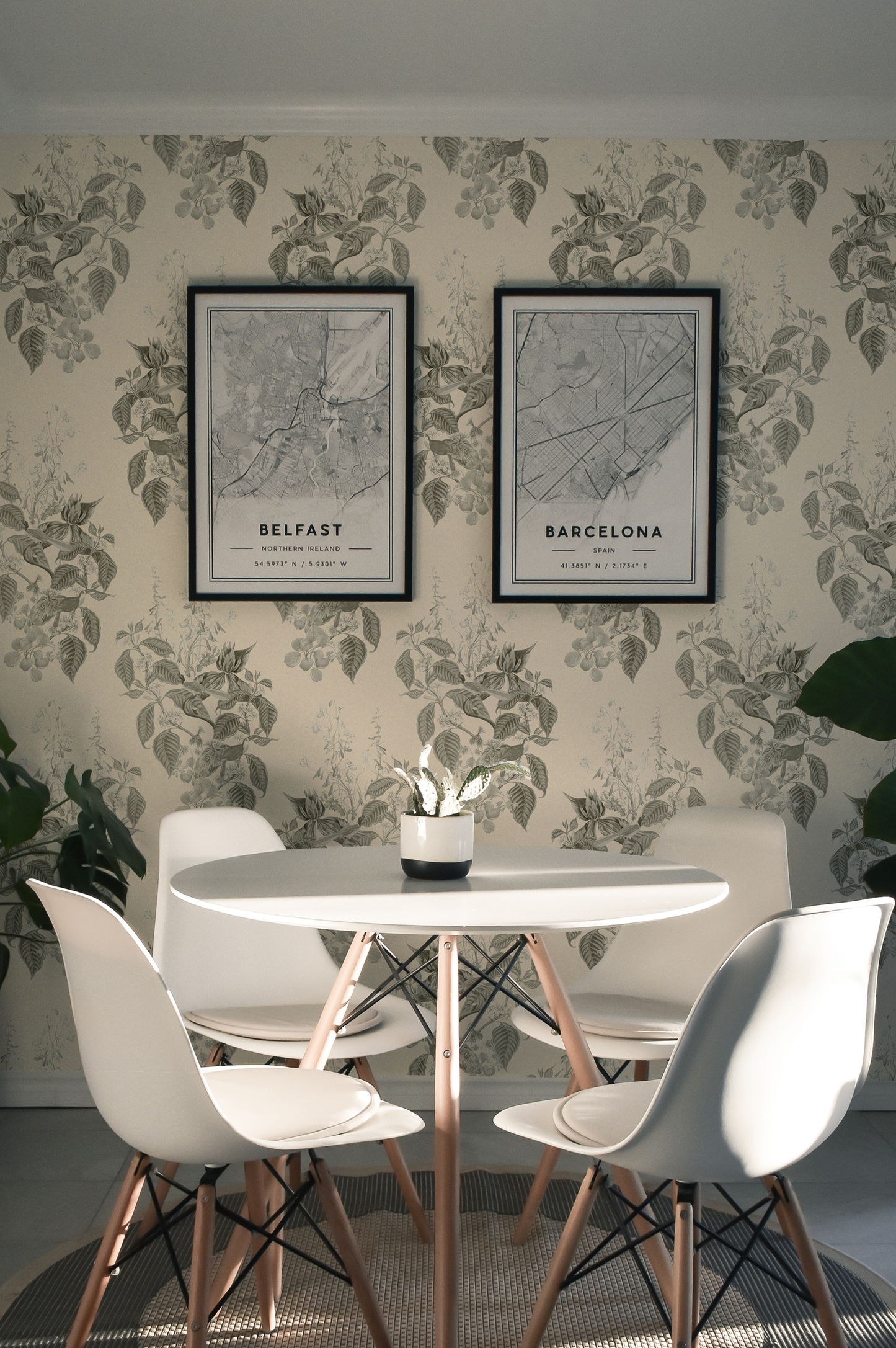 Table and chairs in dining room surrounded Luxury Botanical Deus ex Gardenia Aviary Isle Wallpaper in French Gray. Photo by Jake Goossen.