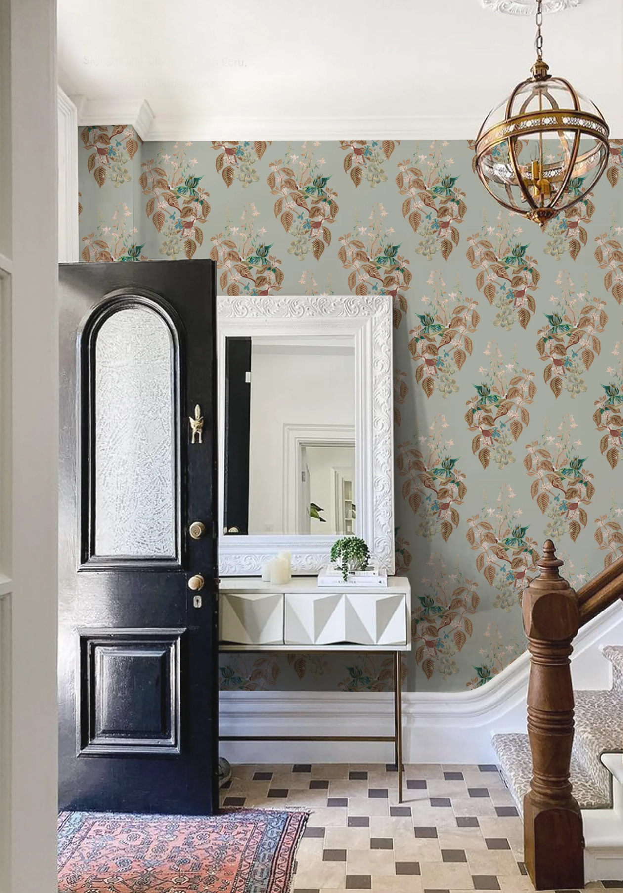 A hallway with Aviary Isle Wallpaper from Deus ex Gardenia in Skylight blue, with a mirror, and a door. Photo by Readmore House Interiors.