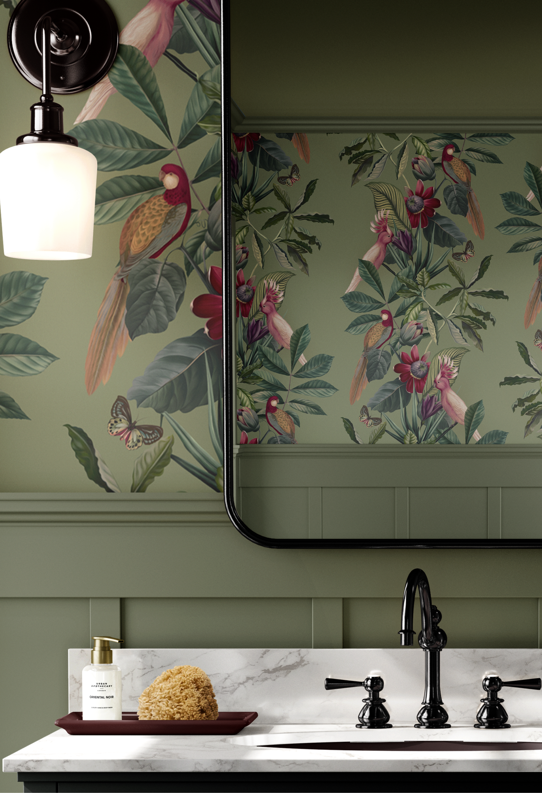 Designer luxurious wallpaper in modern bathroom with sink, light and mirror reflecting the Passiflora wallpaper in Sage by Deus Ex Gardenia.