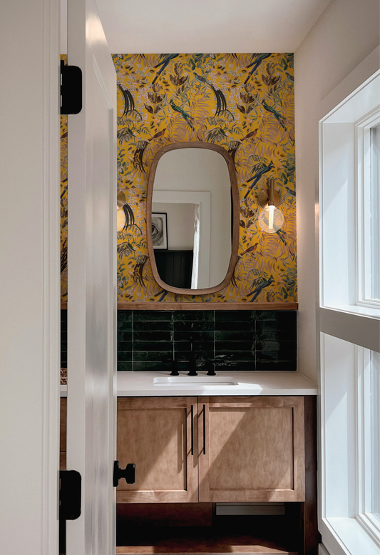 Modern Powder room with vanity cabinet and mirror surrounded by Deus ex Gardenia's tropical 'Resplendent Woods' Wallpaper in India Yellow. Photo by MK-S.